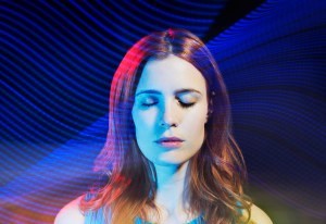 woman with eyes closed with light trails